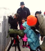 Experienced birders are excited to share their passion with new folks, young and old. This weekend, enthusiastic birders carefully lowered spotting scopes and shared binoculars so young children could get a look at the snowy owls, too. Seeing a snowy owl is a real treat!